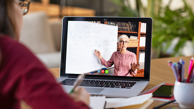 A student using a laptop to learn online.