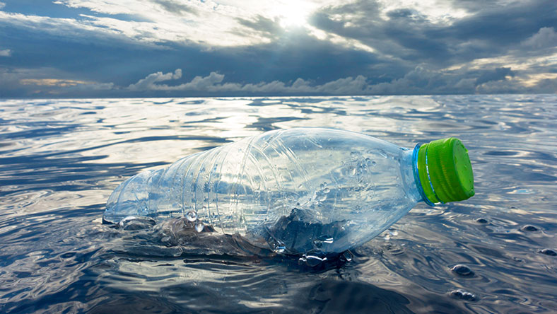 Plastic water bottle floating in ocean