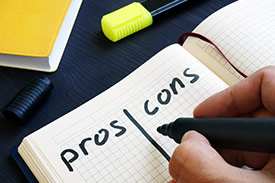 Writing a pros and cons list about life's big expenses and how to manage them.